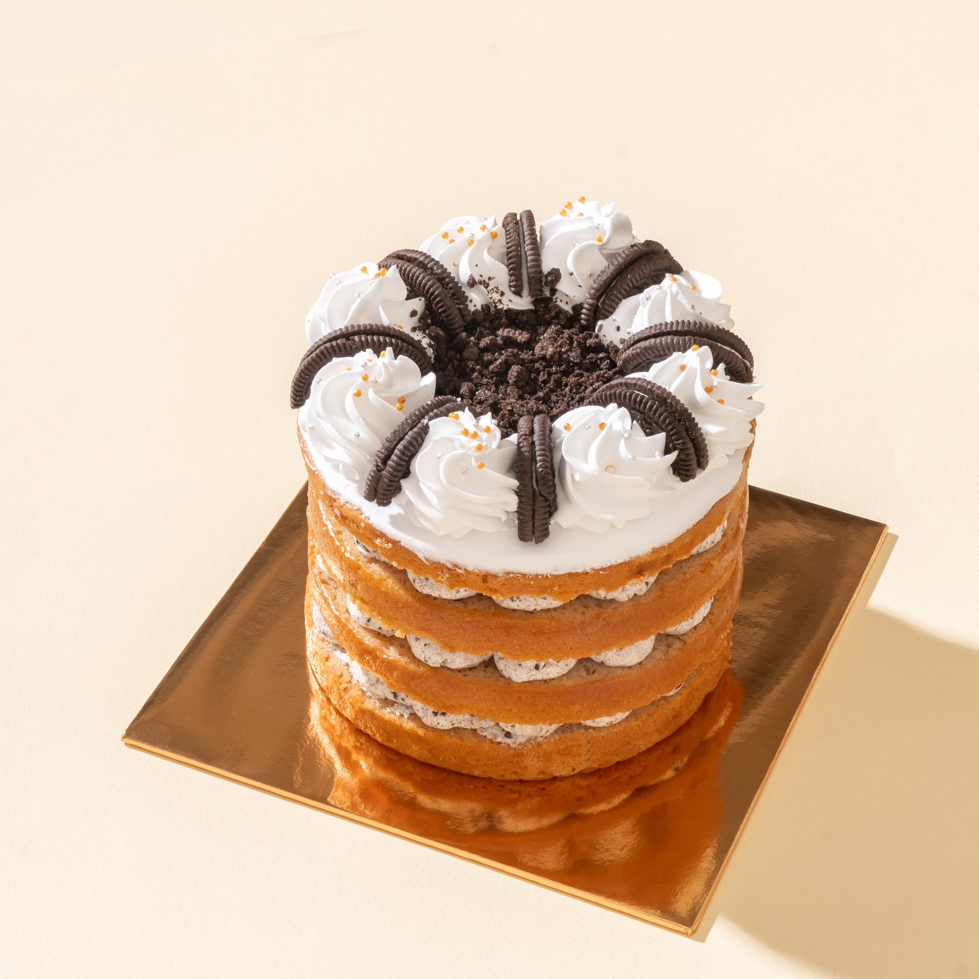 Oreo Vegan Naked Cake with soft vanilla sponge layers, creamy vegan Oreo frosting, and crushed Oreo topping, a dairy-free dessert perfect for Oreo lovers.