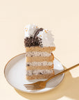Oreo Vegan Naked Cake with soft vanilla sponge layers, creamy vegan Oreo frosting, and crushed Oreo topping, a dairy-free dessert perfect for Oreo lovers.
