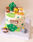 Custom animal-themed birthday cake featuring jungle animals