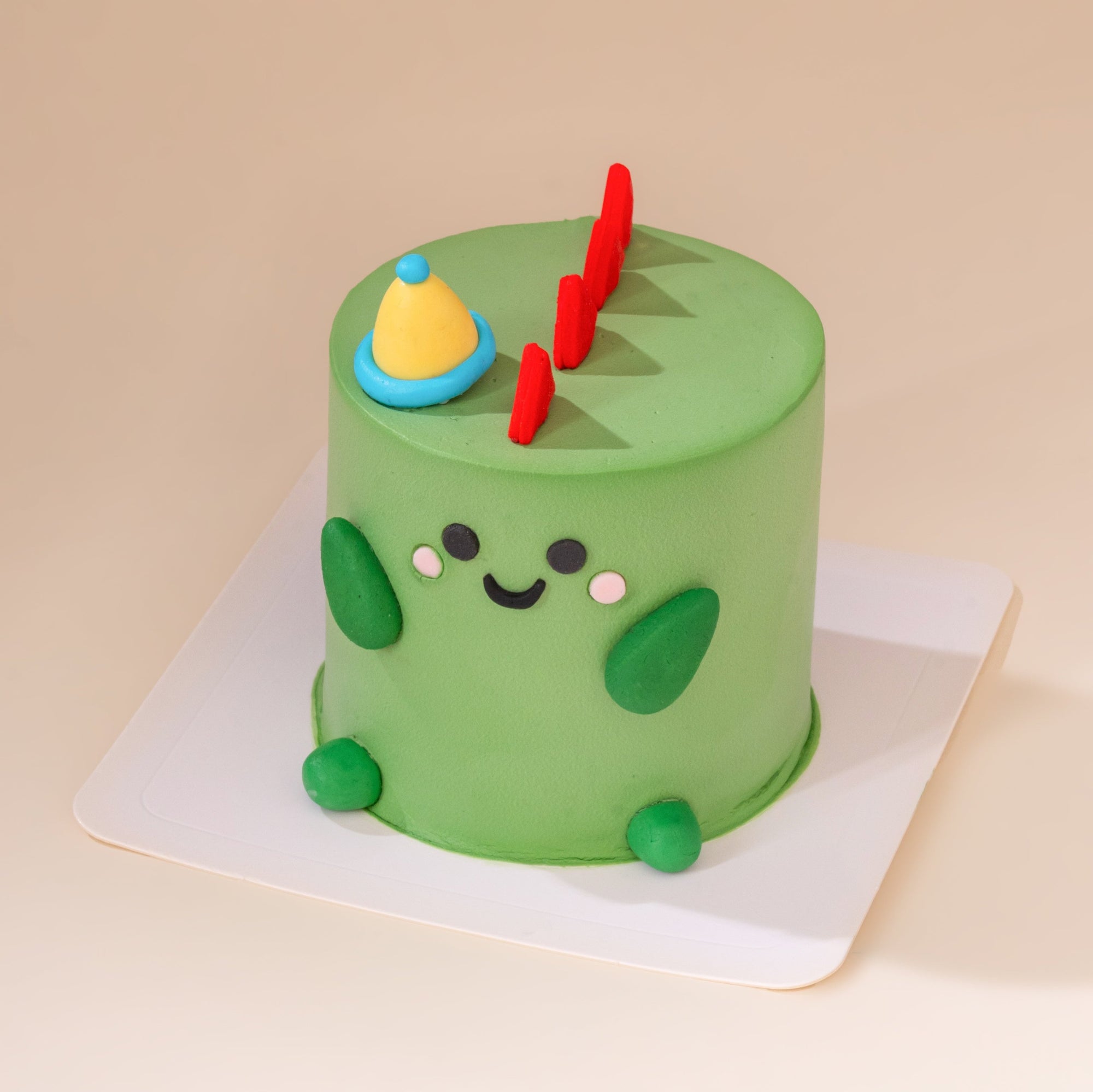 Mini 3-inch custom cake featuring a Green Dinosaur design, perfect for birthdays and celebrations in Malaysia. Handcrafted designer cake available for delivery.