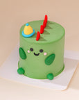 Mini 3-inch custom cake featuring a Green Dinosaur design, perfect for birthdays and celebrations in Malaysia. Handcrafted designer cake available for delivery.